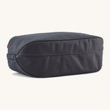 The underside of the Patagonia 3L black hole cube travel bag in smolder blue/ amanita red showing the bottom panel detail