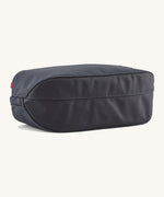 The underside of the Patagonia 3L black hole cube travel bag in smolder blue/ amanita red showing the bottom panel detail