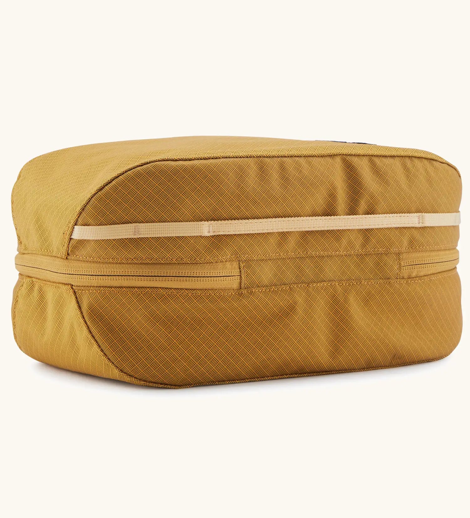 Patagonia black hole 6 litre cube bag in mustard yellow showing the main zip running underneath