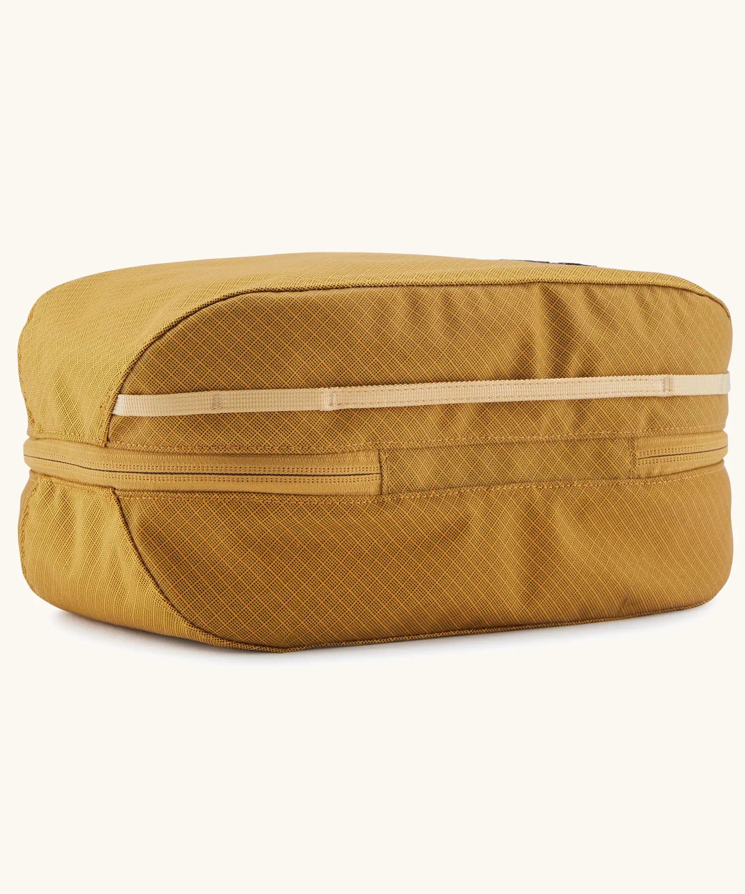 Patagonia black hole 6 litre cube bag in mustard yellow showing the main zip running underneath
