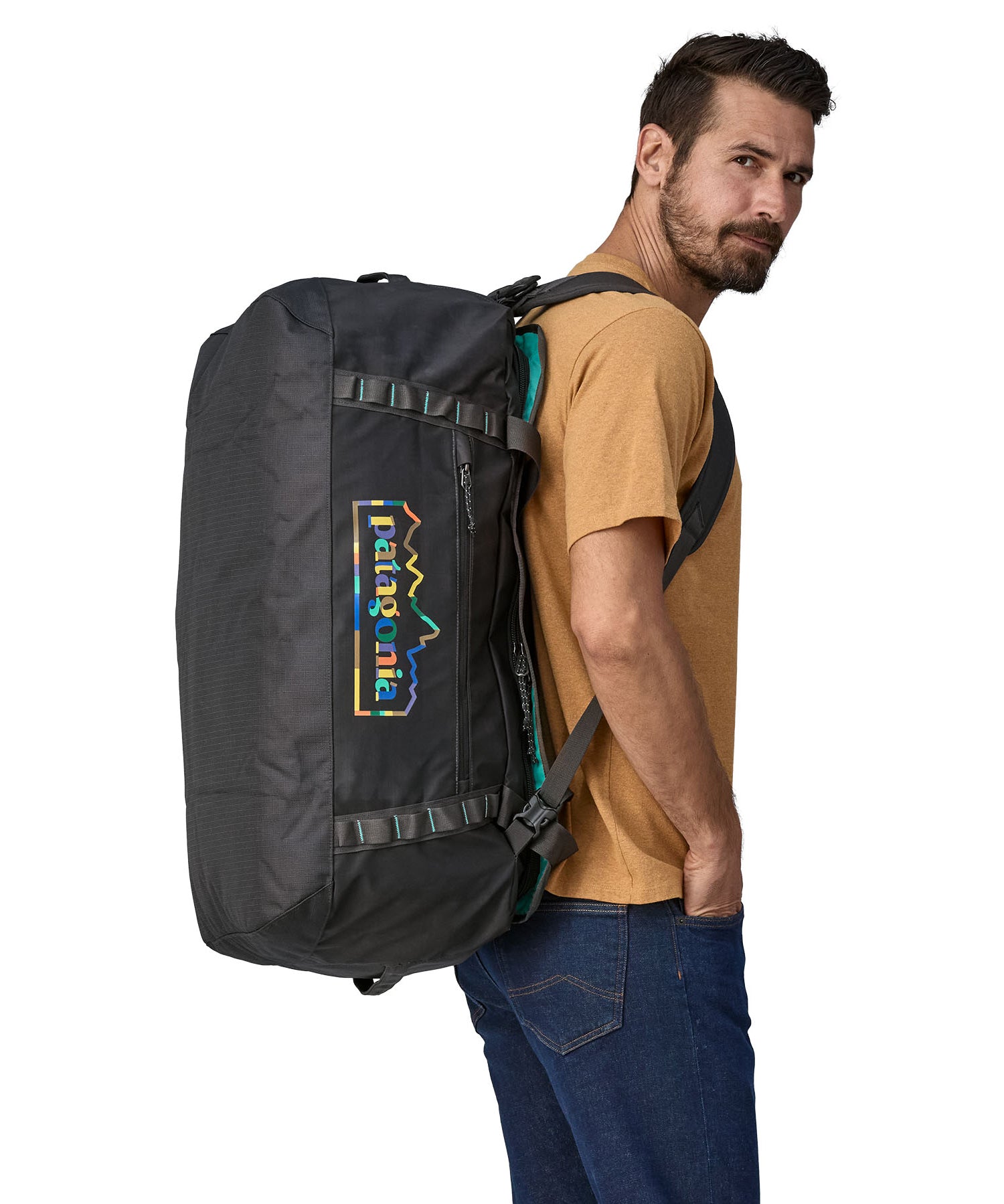 A person carrying the Patagonia Black Hole Duffel 70L Ink Black on their back with the shoulder straps