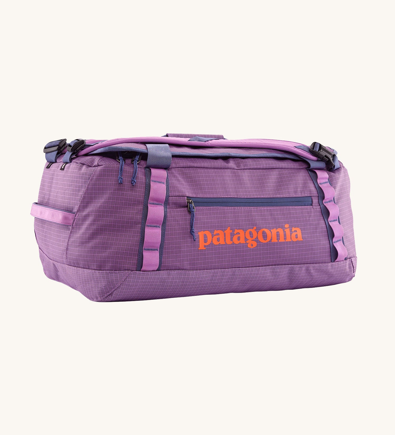Patagonia black hole 40l duffel bag in brisk purple available at Babipur. A bright purple bag with orange branding on the side. Features shoulders straps and a handle on the top for easy carrying.