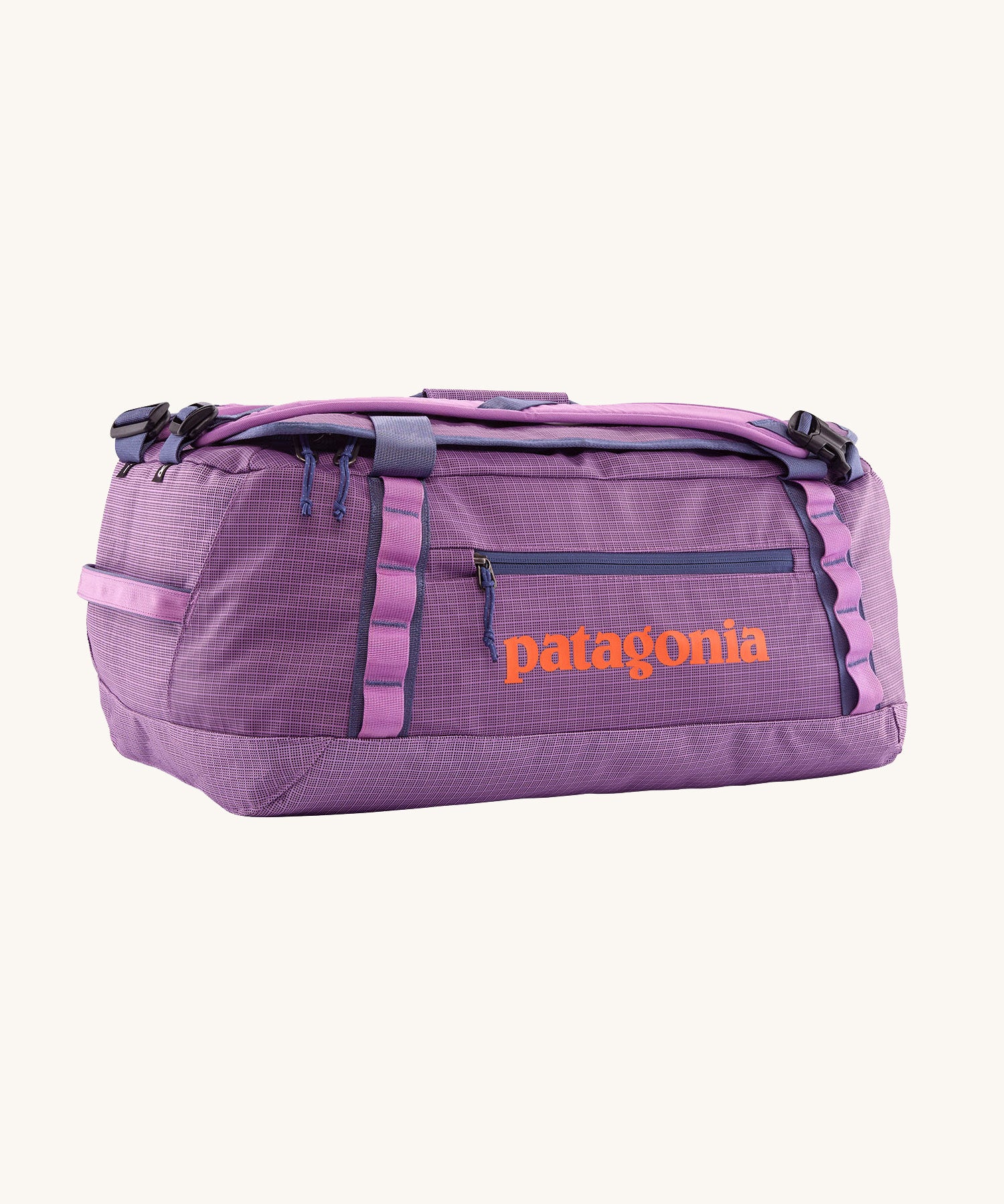 Patagonia black hole 40l duffel bag in brisk purple available at Babipur. A bright purple bag with orange branding on the side. Features shoulders straps and a handle on the top for easy carrying.