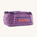 Patagonia black hole 40l duffel bag in brisk purple available at Babipur. A bright purple bag with orange branding on the side. Features shoulders straps and a handle on the top for easy carrying.