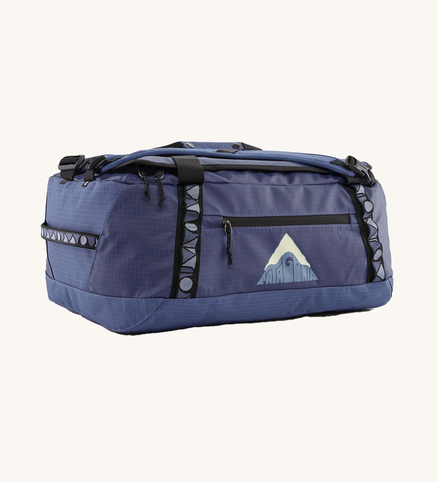 Patagonia black hole 40l duffel bag in current blue available at Babipur. A blue bag with black trim and a mountain graphic on the side. Features shoulders straps and a handle on the top for easy carrying.
