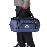 A man carrying the Patagonia black hole 40l duffel bag in current blue available at Babipur. 