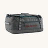 Patagonia black hole 40l duffel bag in noble grey available at Babipur. A dark grey bag with green trim and brown branding on the side. Features shoulders straps and a handle on the top for easy carrying.