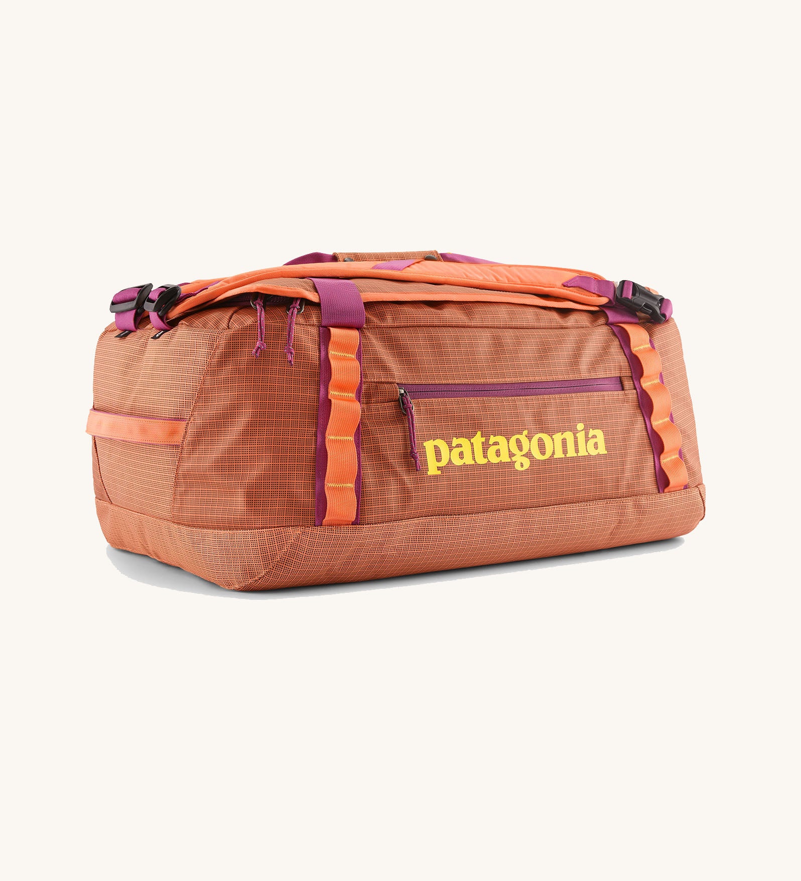 Patagonia black hole 40l duffel bag in bright orange with purple zip details and yellow printed logo on front panel