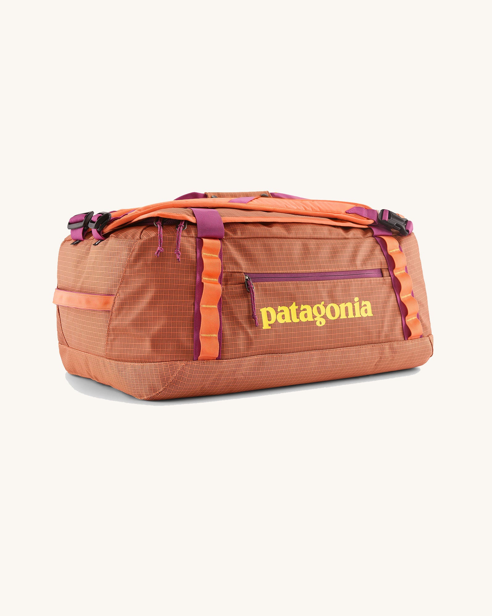 Patagonia black hole 40l duffel bag in bright orange with purple zip details and yellow printed logo on front panel