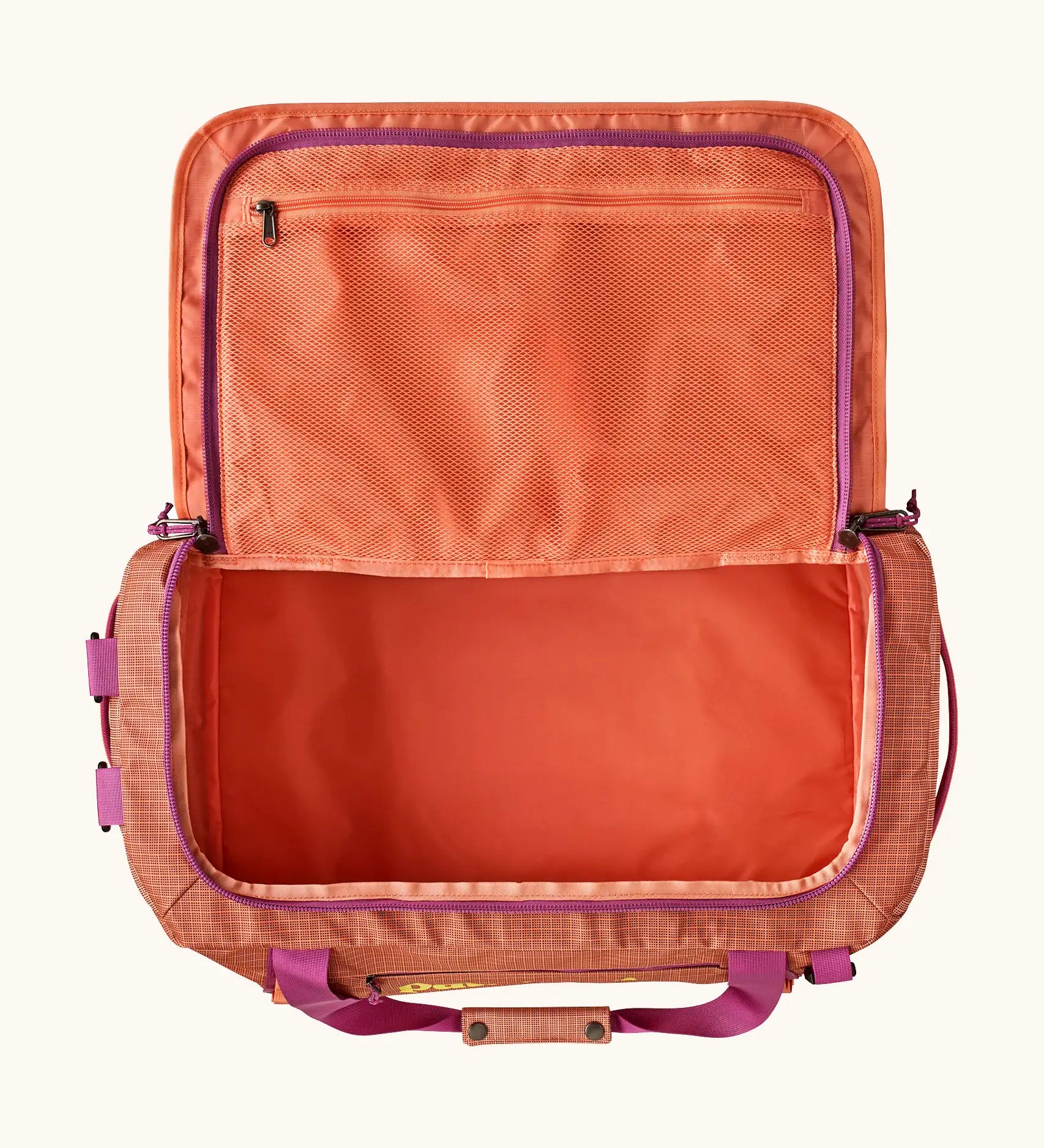 Open Patagonia black hole 40l duffel bag in light orange showing extra zipped mesh compartment on inside lid