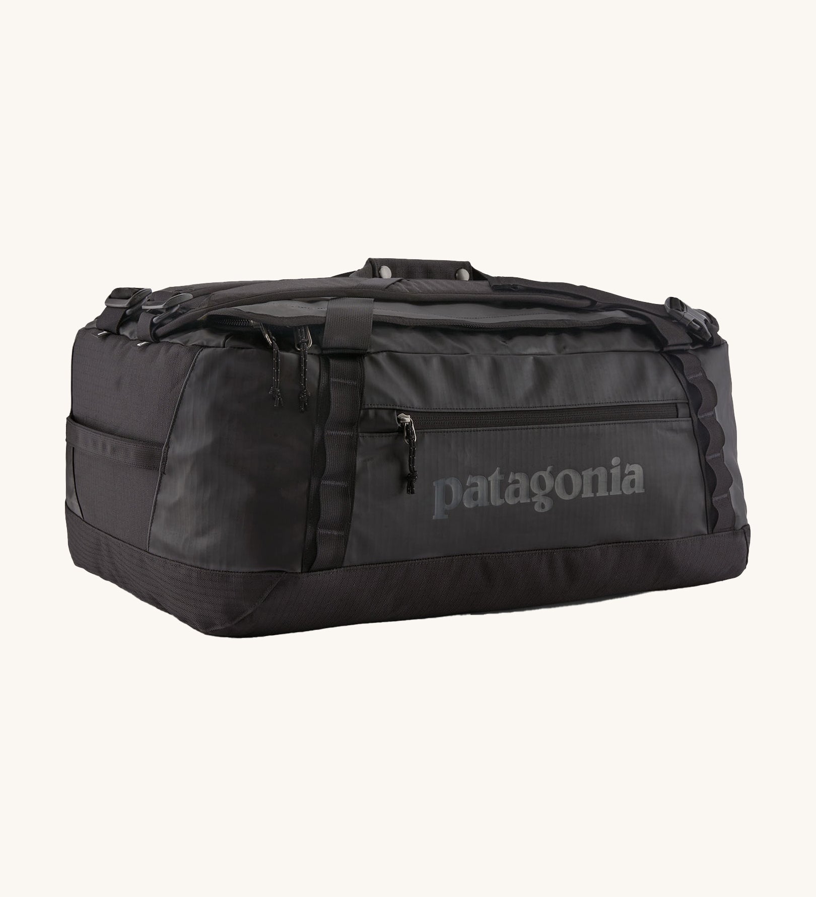 Patagonia black hole 55L duffel bag in black on black available at Babipur. An all black backpack with  shoulders straps and a handle on the top for easy carrying.