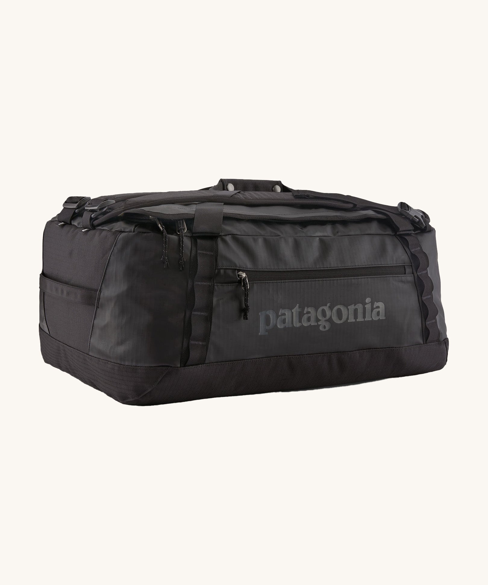 Patagonia black hole 55L duffel bag in black on black available at Babipur. An all black backpack with  shoulders straps and a handle on the top for easy carrying.