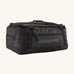 Patagonia black hole 55L duffel bag in black on black available at Babipur. An all black backpack with  shoulders straps and a handle on the top for easy carrying.