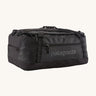 Patagonia black hole 55L duffel bag in black on black available at Babipur. An all black backpack with  shoulders straps and a handle on the top for easy carrying.