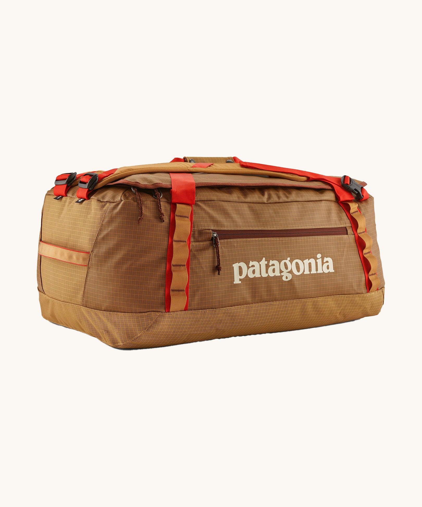Patagonia black hole 55L duffel bag in talon gold available at Babipur. A dark yellow colour bag with red trim and a cream colour branding  on the side. Features shoulders straps and a handle on the top for easy carrying.