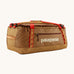 Patagonia black hole 55L duffel bag in talon gold available at Babipur. A dark yellow colour bag with red trim and a cream colour branding  on the side. Features shoulders straps and a handle on the top for easy carrying.