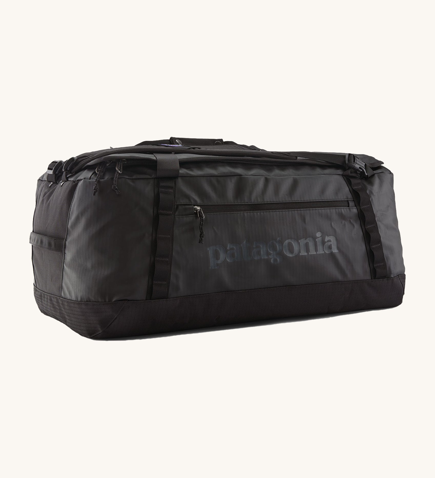 Patagonia black hole 70L duffel bag in black on black available at Babipur. An all black backpack with  shoulders straps and a handle on the top for easy carrying.