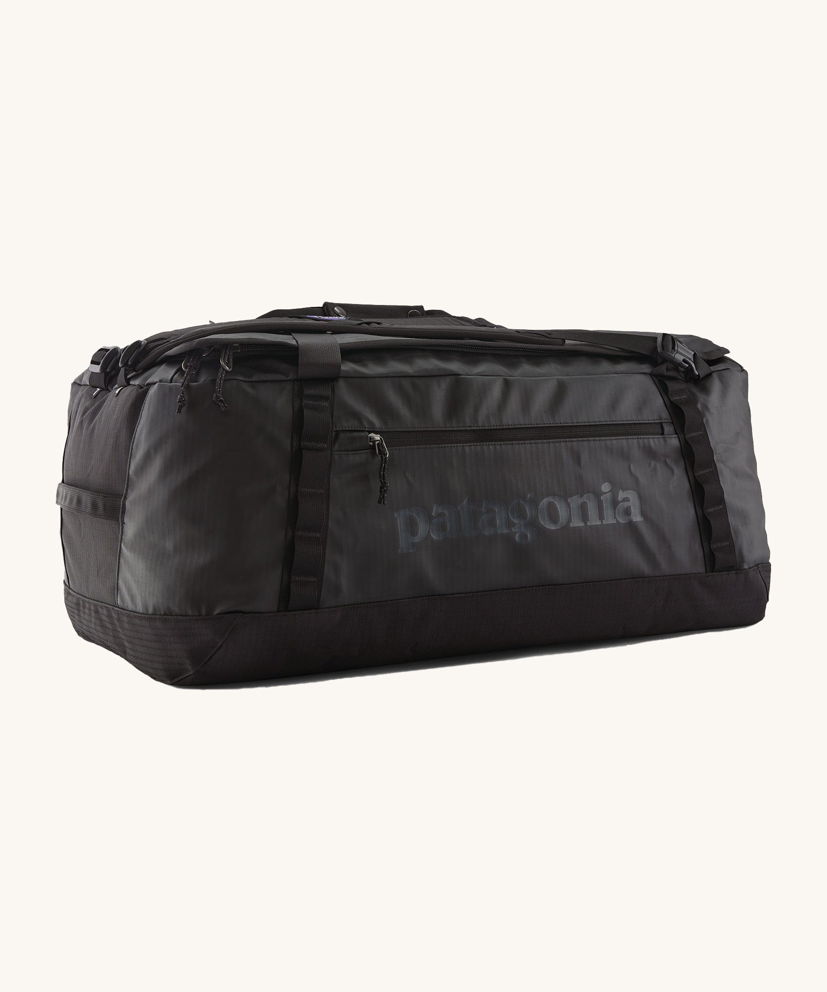 Patagonia black hole 70L duffel bag in black on black available at Babipur. An all black backpack with  shoulders straps and a handle on the top for easy carrying.