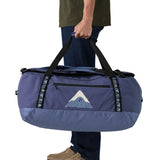 A man carrying the Patagonia black hole 70L duffel bag in current blue available at Babipur. 