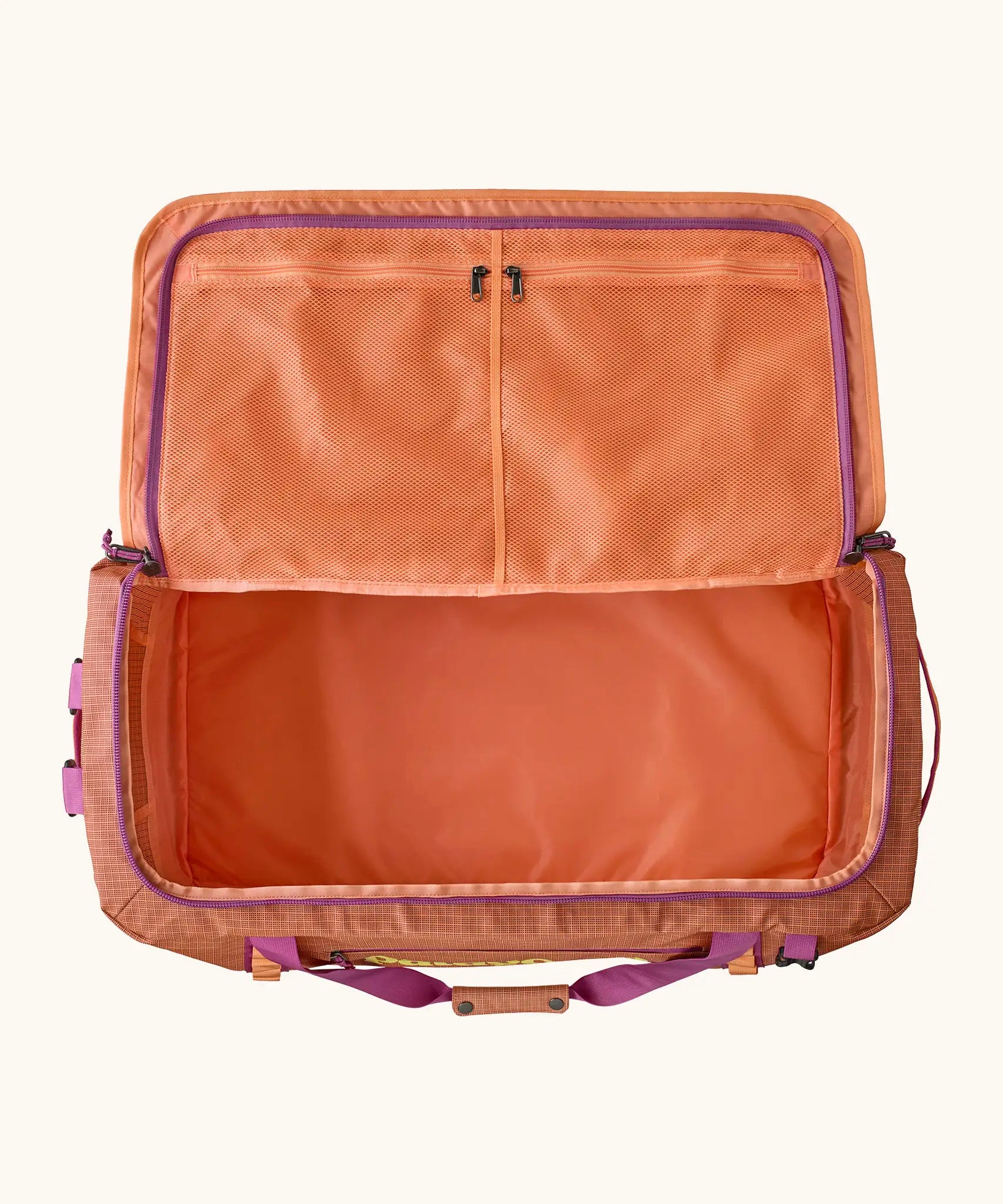 Open Patagonia black hole 70l duffel bag in bright orange showing extra zipped mesh compartments on inside lid
