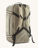Patagonia black hole 70l duffel bag in pale green with matching shoulder straps and extra black carry handles