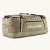 Patagonia black hole 70l duffel bag in pale green with black zip details, straps and cream printed logo on front panel 