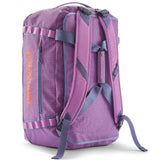 A close up of the Patagonia black hole 40l duffel bag in brisk purple available at Babipur showing the shoulder straps and carry straps detail