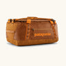 Patagonia black hole 40l duffel bag in cinnamon brown with matching zip details, carry straps and orange logo printed on the side