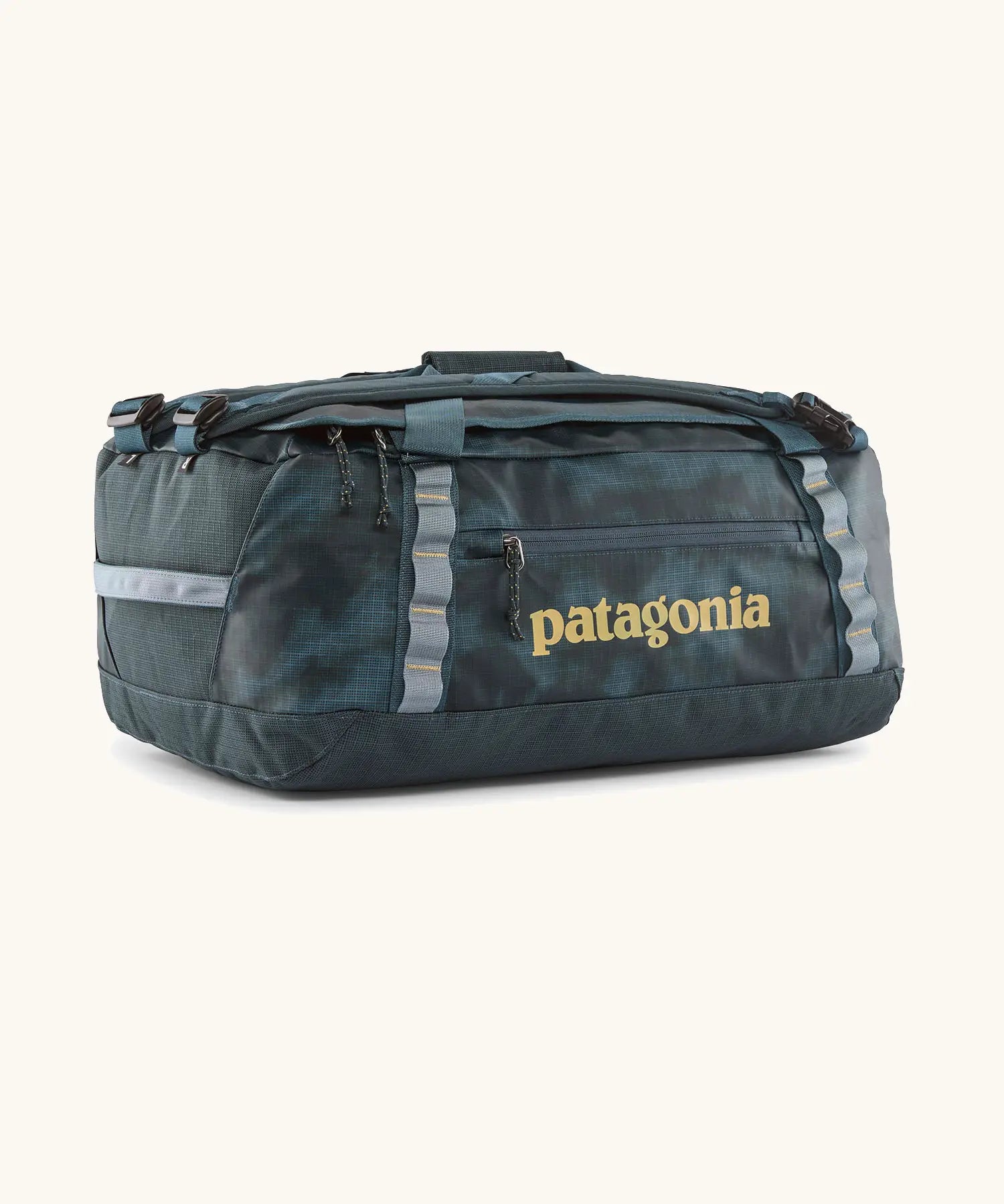 Patagonia black hole 40l duffel bag in deep teal with matching zip details, carry straps and yellow logo printed on the side