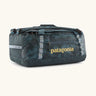 Patagonia black hole 40l duffel bag in deep teal with matching zip details, carry straps and yellow logo printed on the side