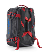 A close up of the Patagonia black hole 40l duffel bag in smolder blue / amanita red  available at Babipur showing the shoulder straps and carry straps detail
