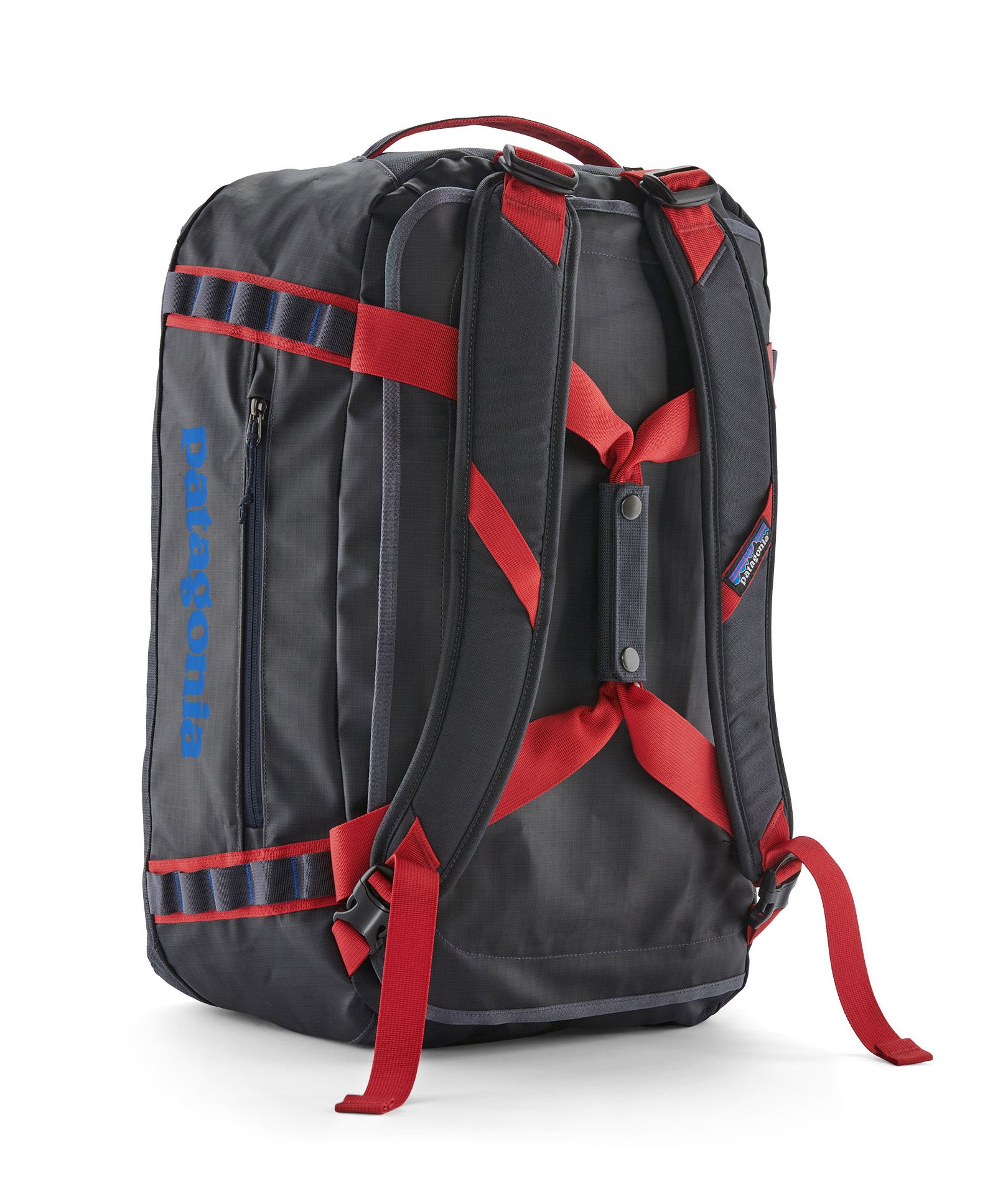 A close up of the Patagonia black hole 40l duffel bag in smolder blue / amanita red  available at Babipur showing the shoulder straps and carry straps detail
