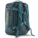 A close up of the Patagonia black hole 40l duffel bag in tidal teal / luminous pink available at Babipur showing the shoulder straps and carry straps detail