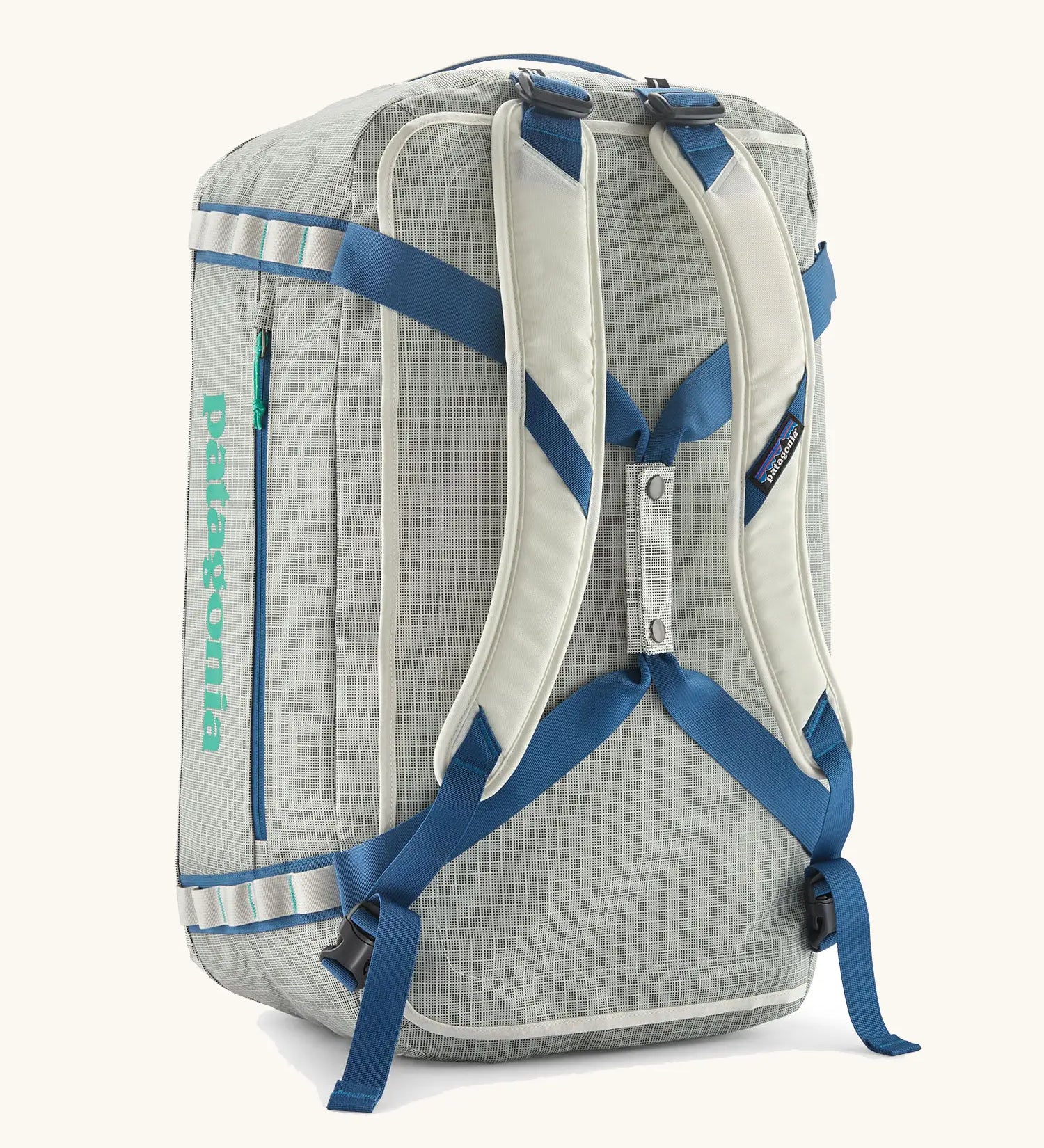 Patagonia black hole 55L duffel bag  in birch white with padded back straps.