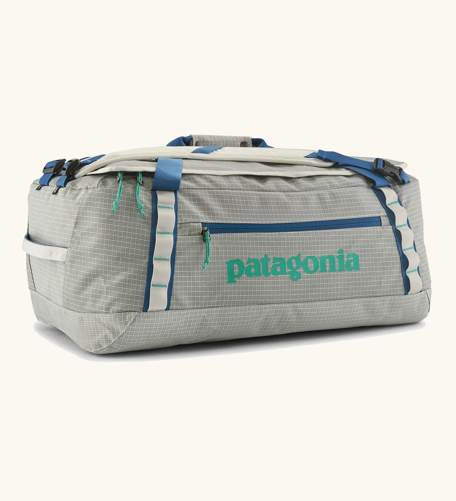 Patagonia black hole 55l duffel bag in birch white with blue zip details and mint green printed logo.
