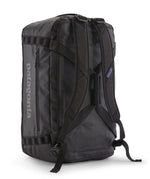 A close up of the Patagonia black hole 55L duffel bag in black on black available at Babipur showing the shoulder straps and carry straps detail