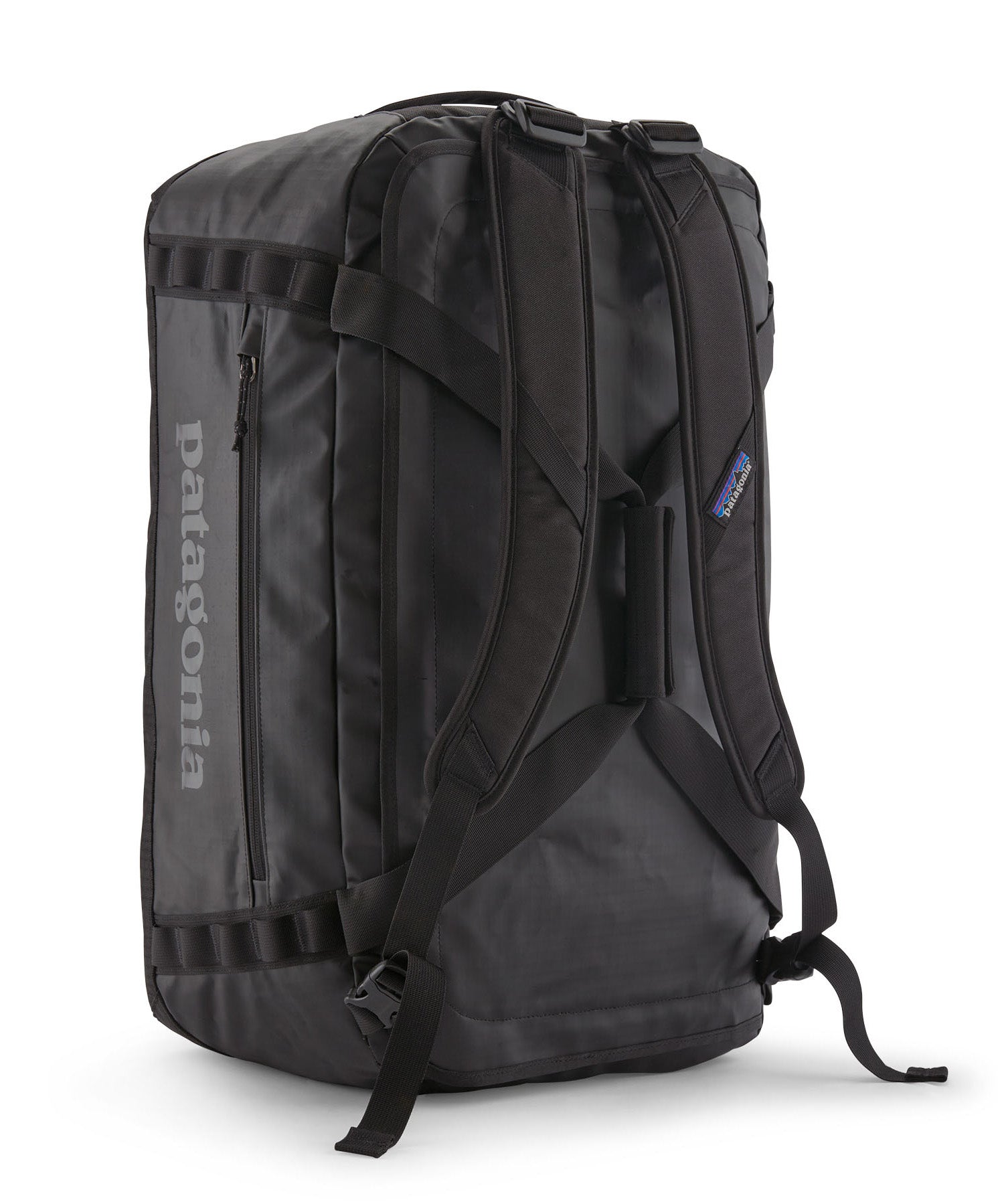 A close up of the Patagonia black hole 55L duffel bag in black on black available at Babipur showing the shoulder straps and carry straps detail