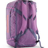 A close up of the Patagonia black hole 55L duffel bag in brisk purple available at Babipur showing the shoulder straps and carry straps detail