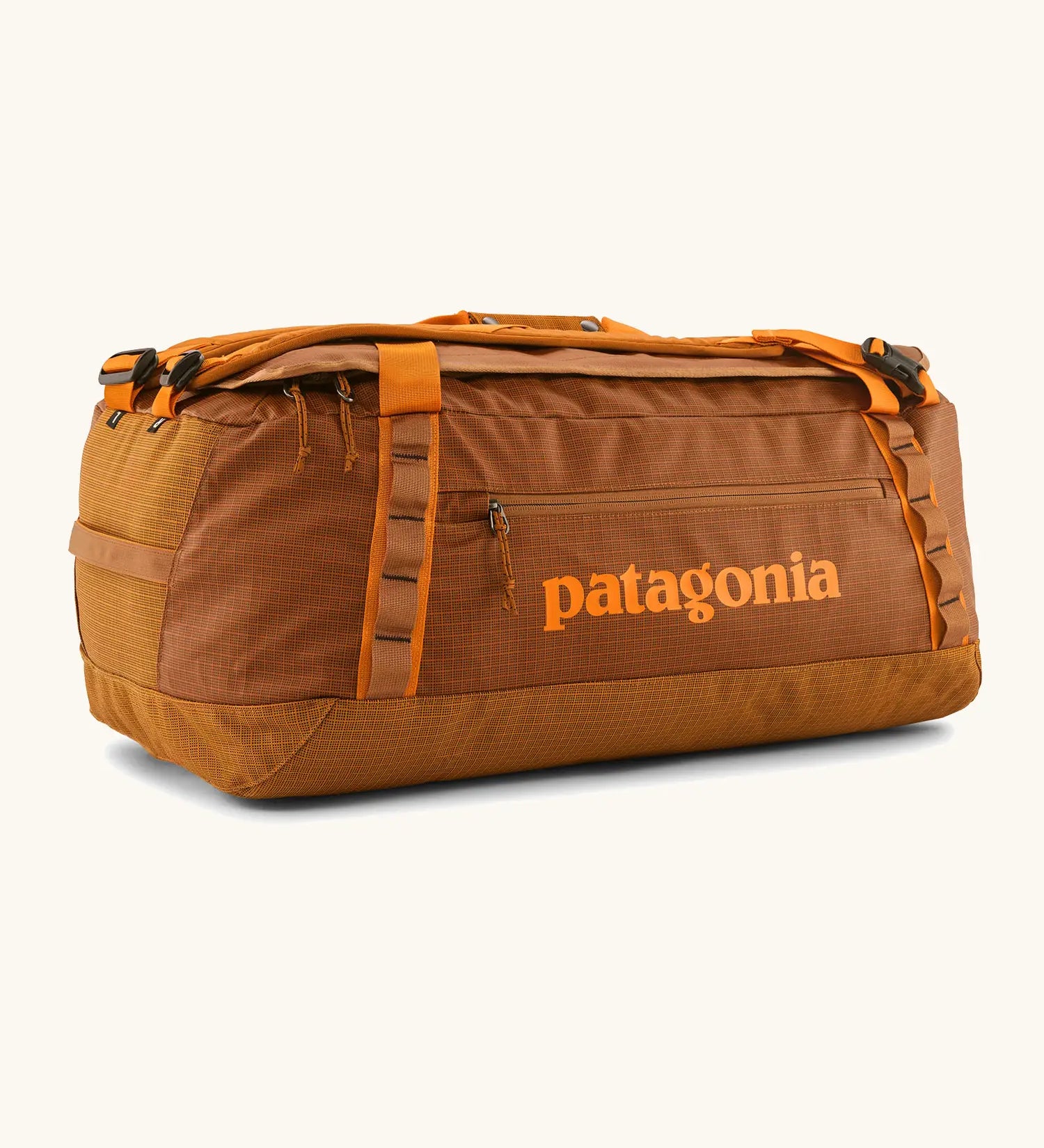 Patagonia black hole 55L duffel bag in Cinnamon Brown. Rusty brown/orange body, Features matching zip details, carry straps, extra carry loop and a printed logo on the side. 