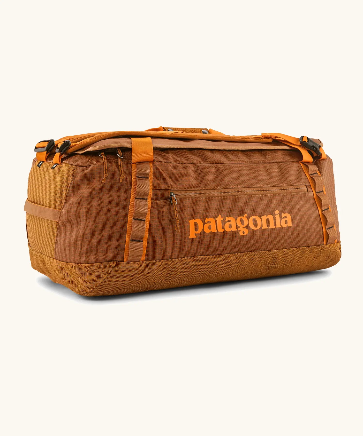 Patagonia black hole 55L duffel bag in Cinnamon Brown. Rusty brown/orange body, Features matching zip details, carry straps, extra carry loop and a printed logo on the side. 