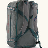 Back of Patagonia black hole 55L duffel bag in grey showing the shoulder straps and carry straps detail