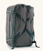 Back of Patagonia black hole 55L duffel bag in grey showing the shoulder straps and carry straps detail