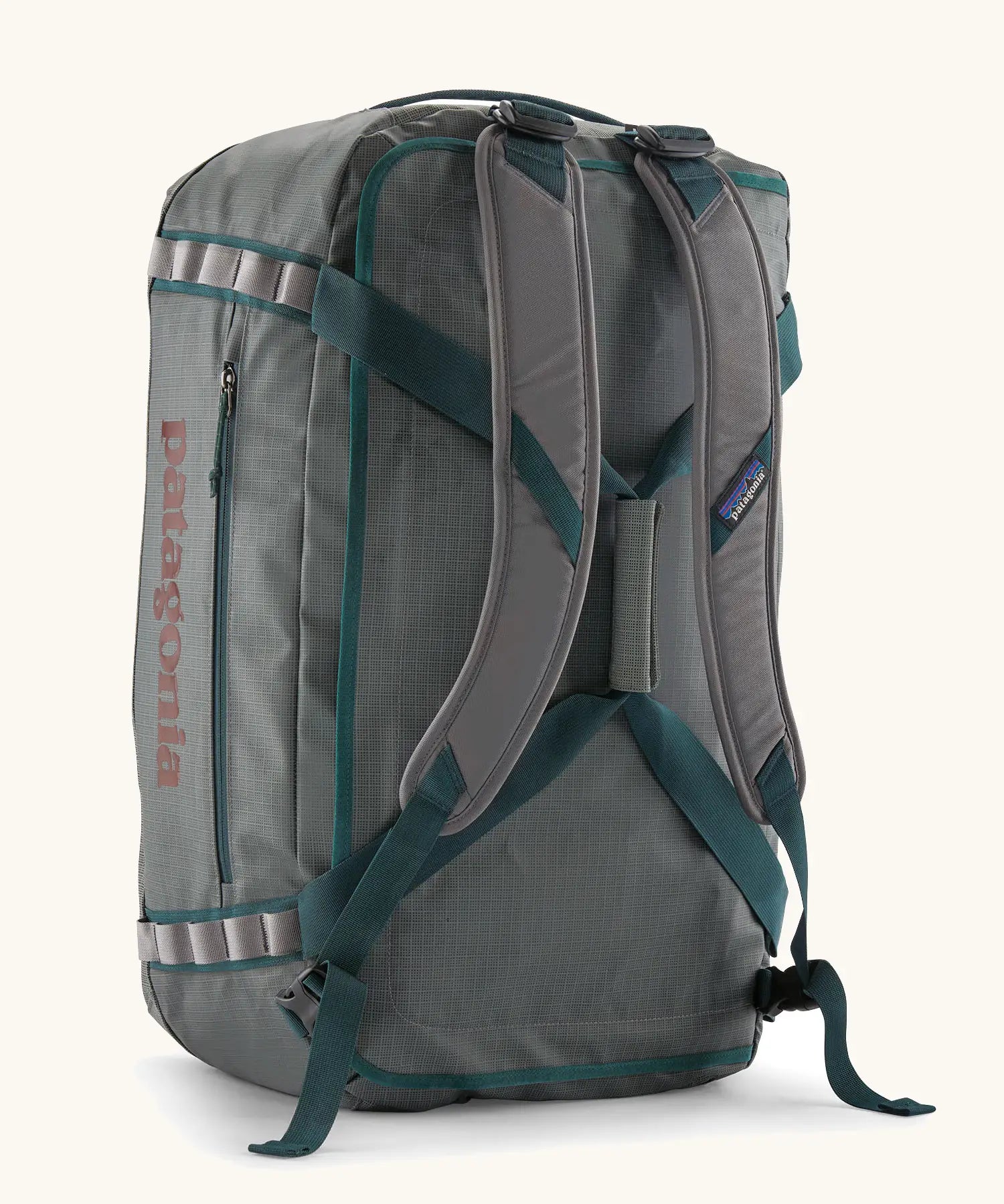 Back of Patagonia black hole 55L duffel bag in grey showing the shoulder straps and carry straps detail
