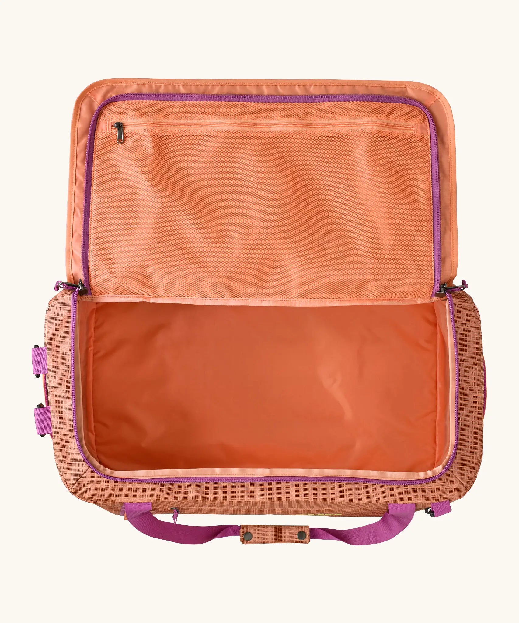 Open Patagonia black hole 55l duffel bag in bright orange showing extra zipped mesh compartments on inside lid