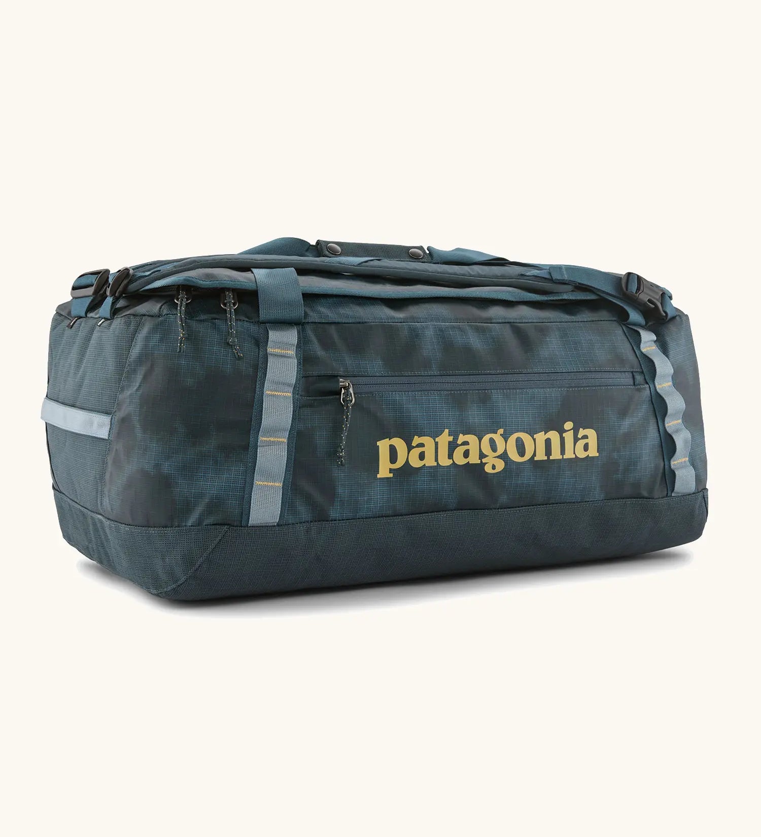Patagonia black hole 55L duffel bag in dark teal. Features matching zip details, carry straps, extra carry loops and a printed logo on the side