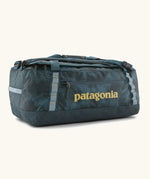 Patagonia black hole 55L duffel bag in dark teal. Features matching zip details, carry straps, extra carry loops and a printed logo on the side