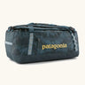 Patagonia black hole 55L duffel bag in dark teal. Features matching zip details, carry straps, extra carry loops and a printed logo on the side