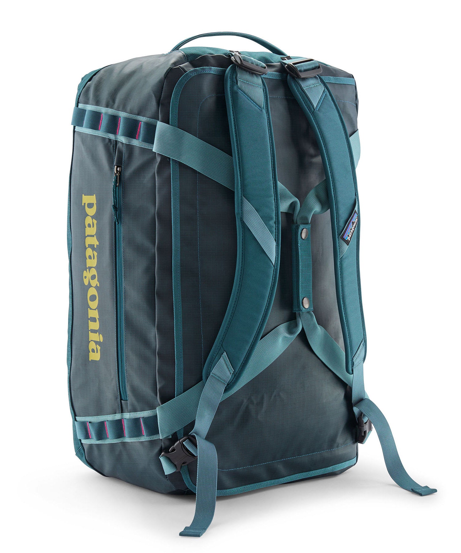 A close up of the Patagonia black hole 55L duffel bag in tidal teal / luminous pink available at Babipur showing the shoulder straps and carry straps detail