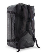 A close up of the Patagonia black hole 70L duffel bag in black on black available at Babipur showing the shoulder straps and carry straps detail