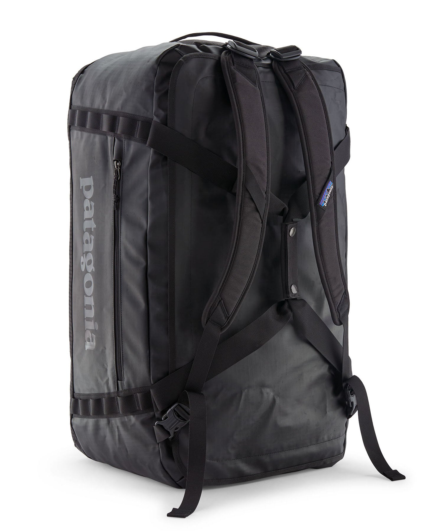 A close up of the Patagonia black hole 70L duffel bag in black on black available at Babipur showing the shoulder straps and carry straps detail